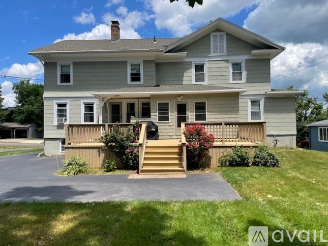 A house with a front porch and a driveway.