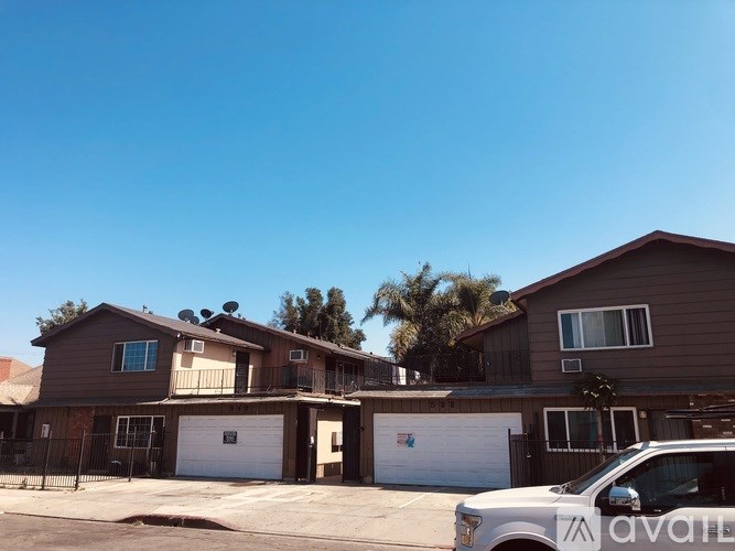 A house with a car parked in front of it.