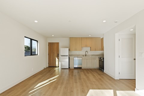 A kitchen with wooden cabinets and white appliances.