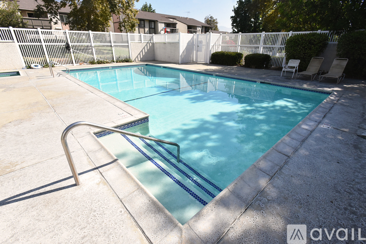 A pool with a slide in the middle of it.