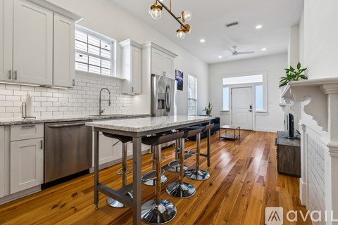 A kitchen with a bar area and a fireplace.
