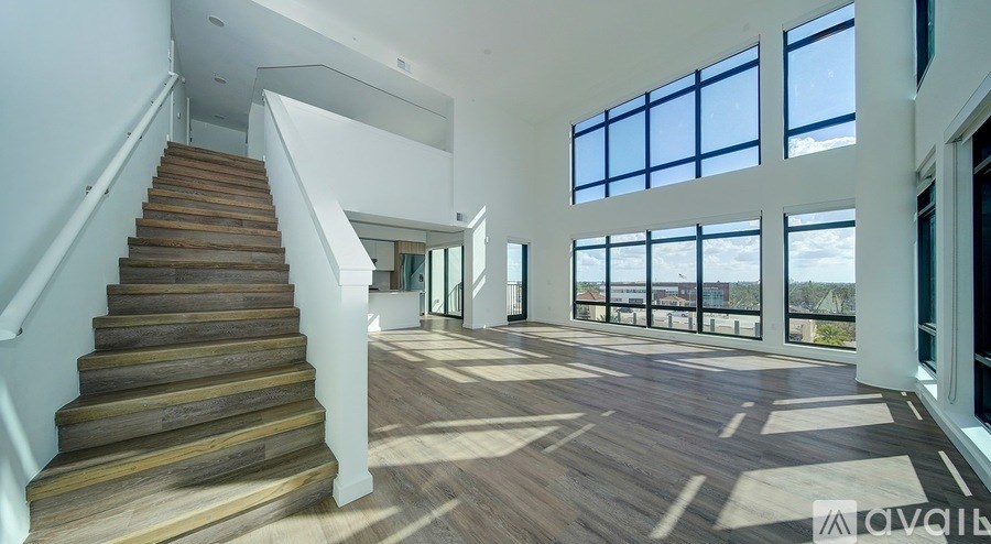 A large open space with a staircase leading to the upper level.