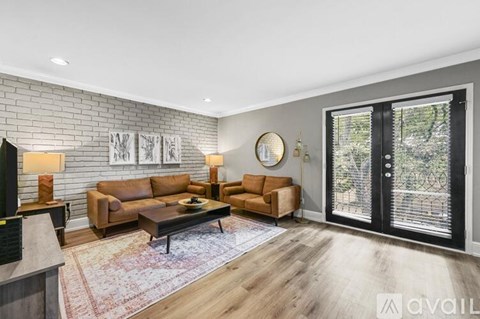 A living room with a fireplace and a couch.