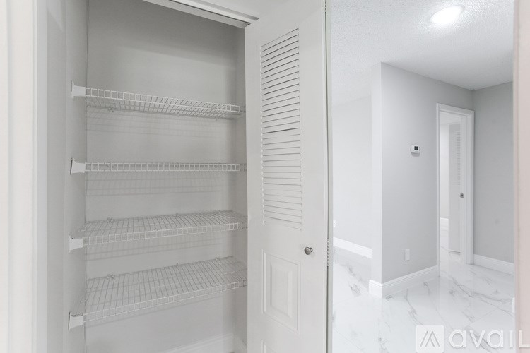 A house with a brown roof and a sign that says "MERAH" in front of it.