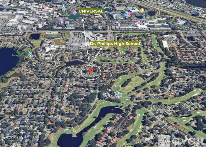 An aerial view of a city with a red marker indicating the location of Dr. Phillips High School.