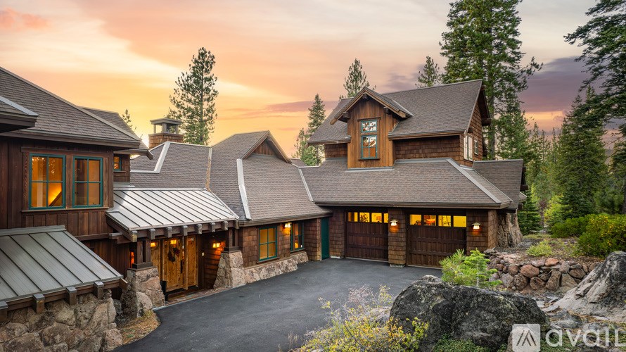 A large house with a driveway in front of it.