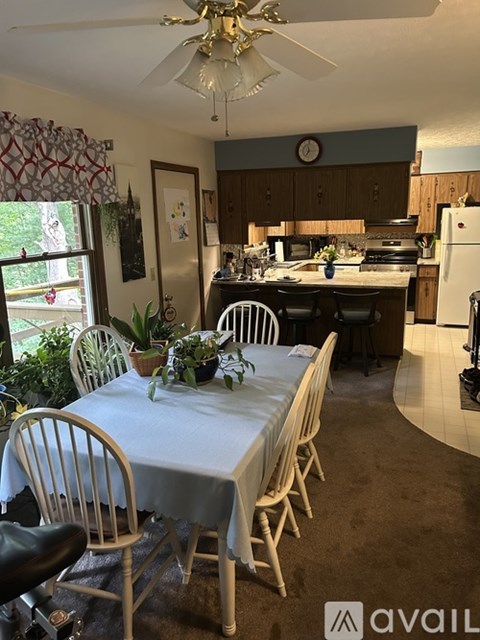 A kitchen with a table set for a meal.