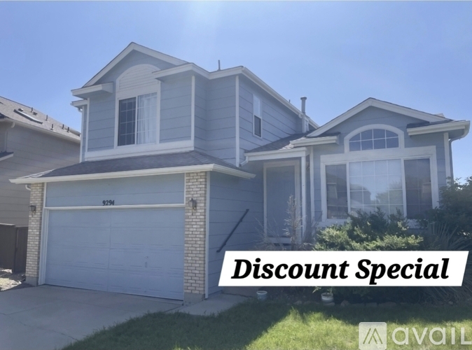 A house with a sign that says "Discount Special" in front of it.