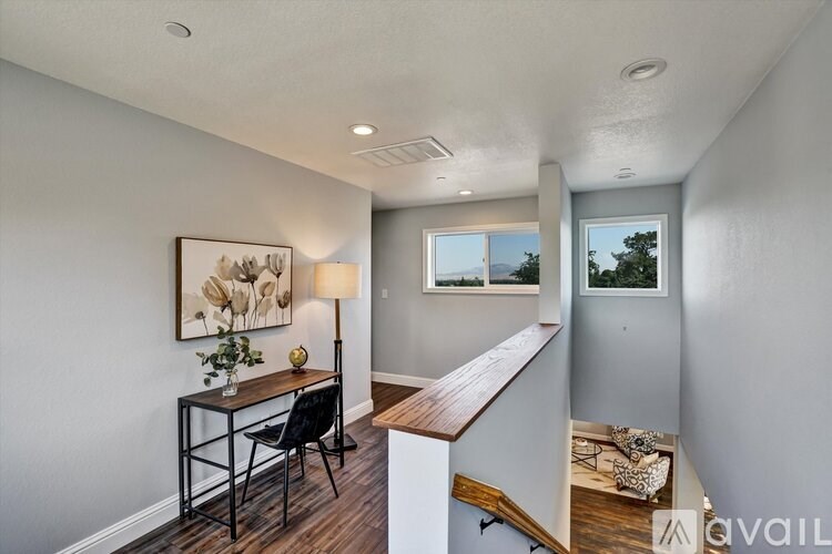 A room with a desk and chair in it.