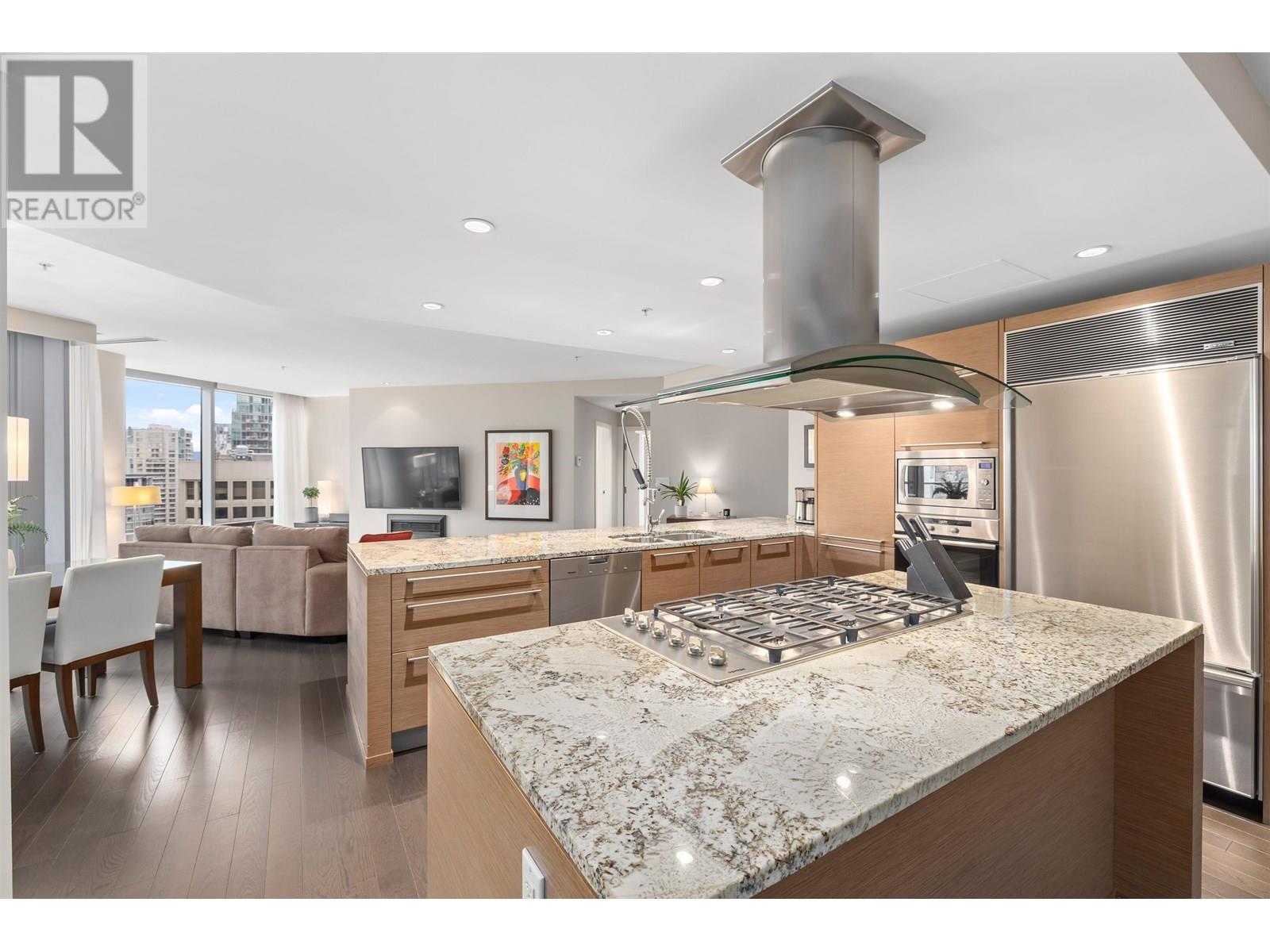 A modern kitchen with a large island in the center.