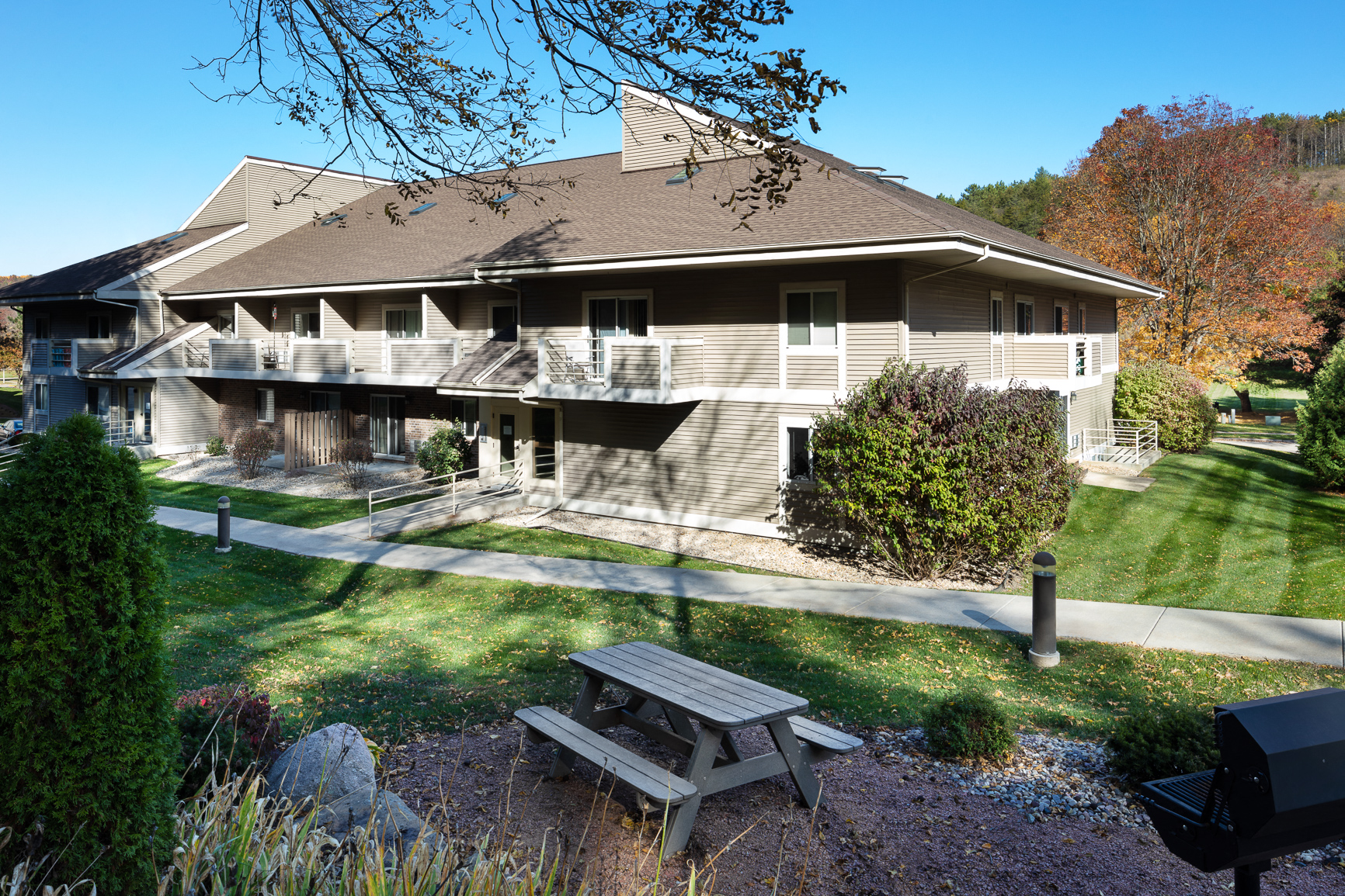 a picnic table in front of a house