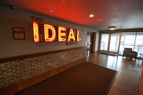 the lobby of the ideal restaurant with a sign on the wall