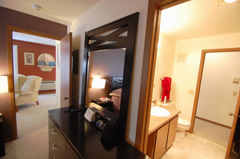 a bathroom with a sink and a mirror in a hotel room