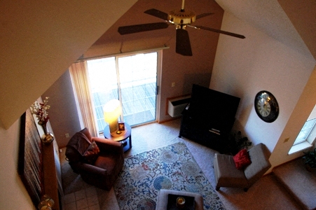 an overhead view of a living room with a ceiling fan