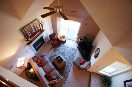 an overhead view of a living room with a ceiling fan