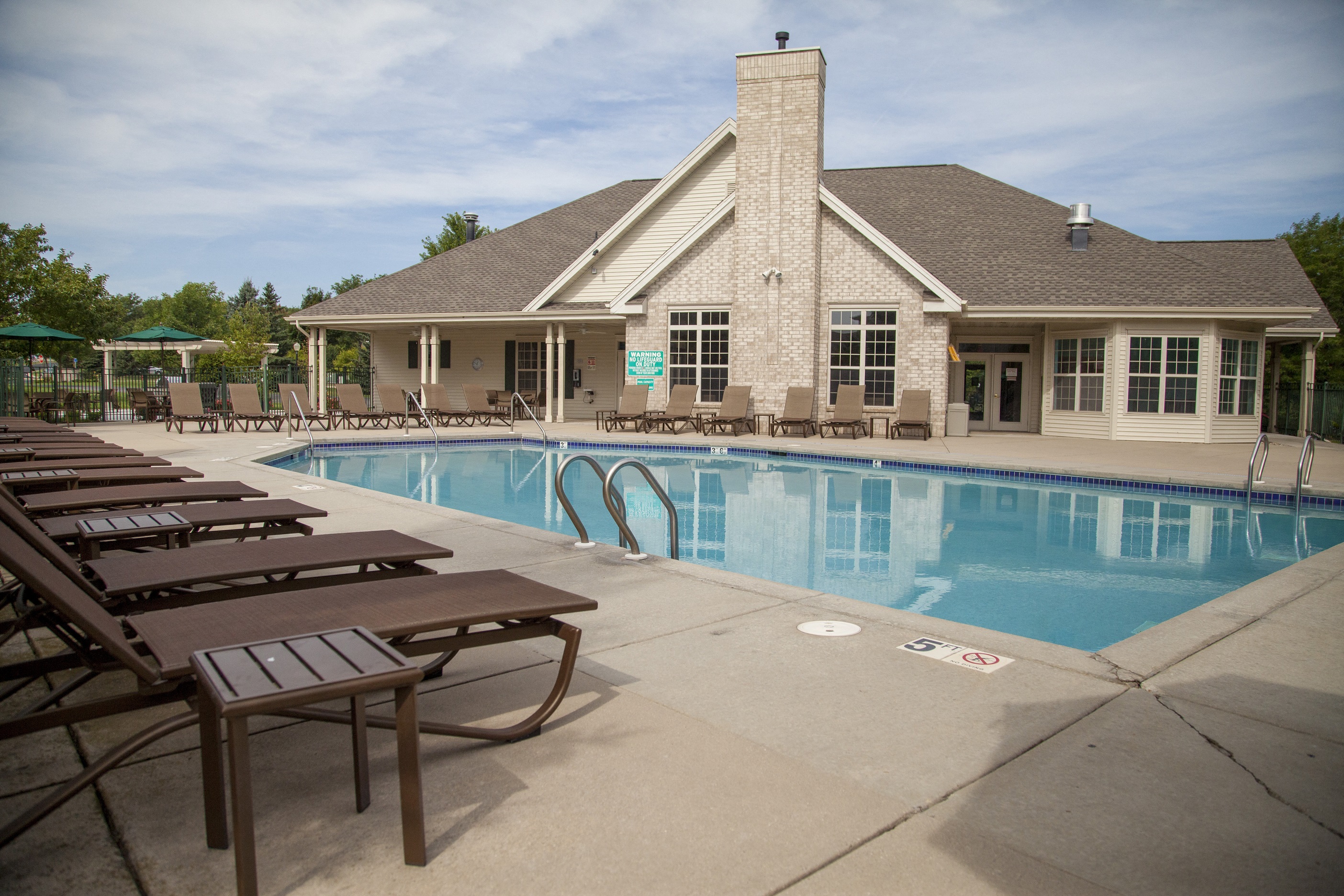 a swimming pool in front of a house