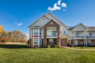 a large house with a lawn in front of it