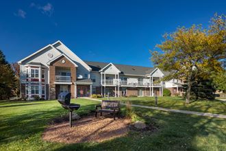 the preserve at ballantyne commons park with a bench in front of a building