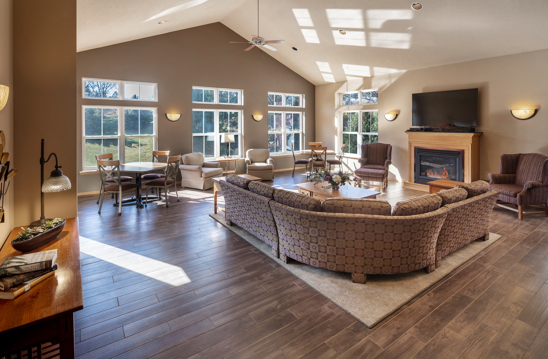 a large living room with a couch and a fire place