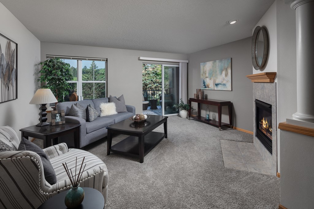 a living room with a couch and a fireplace