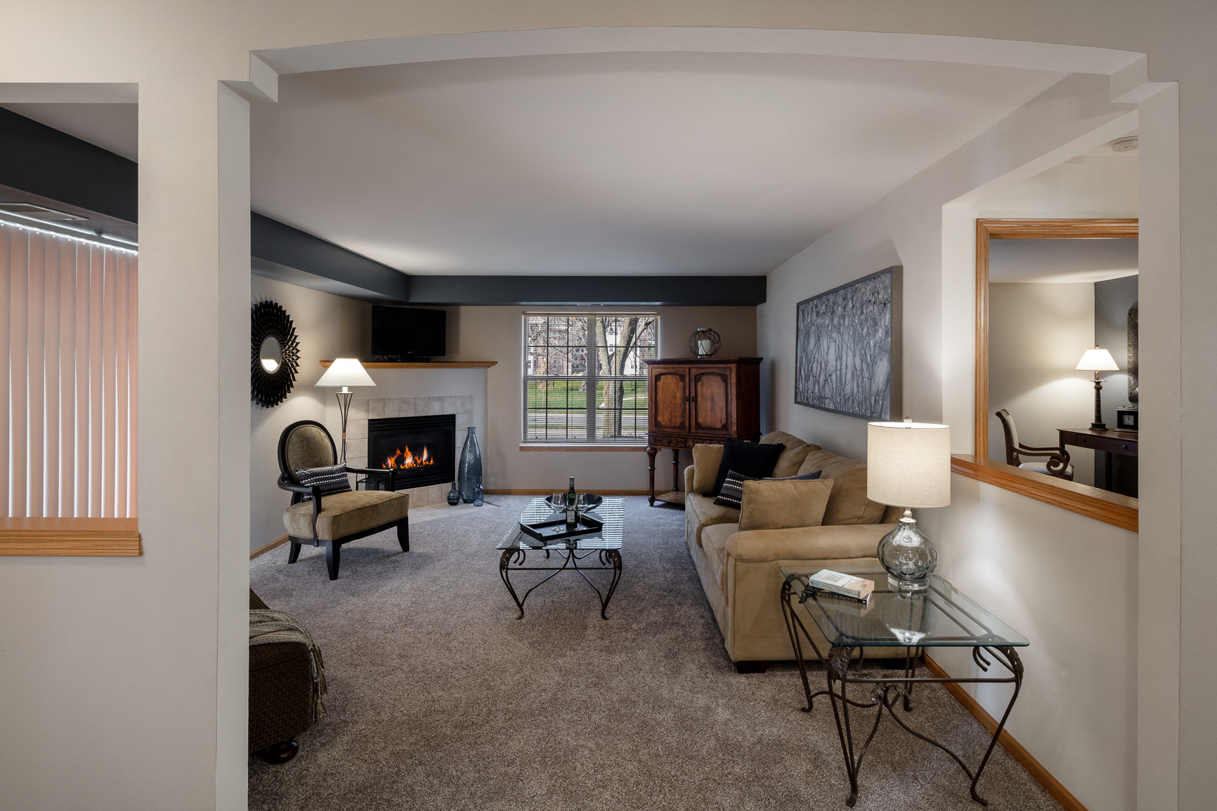 a living room with a couch and a fireplace