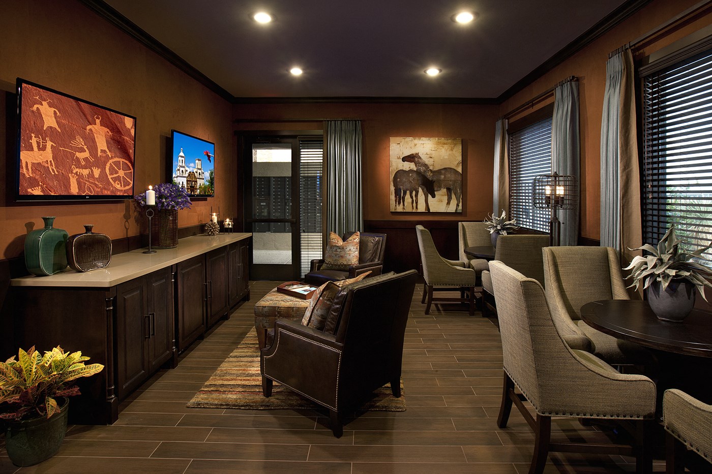 a living room with a table and chairs and a counter