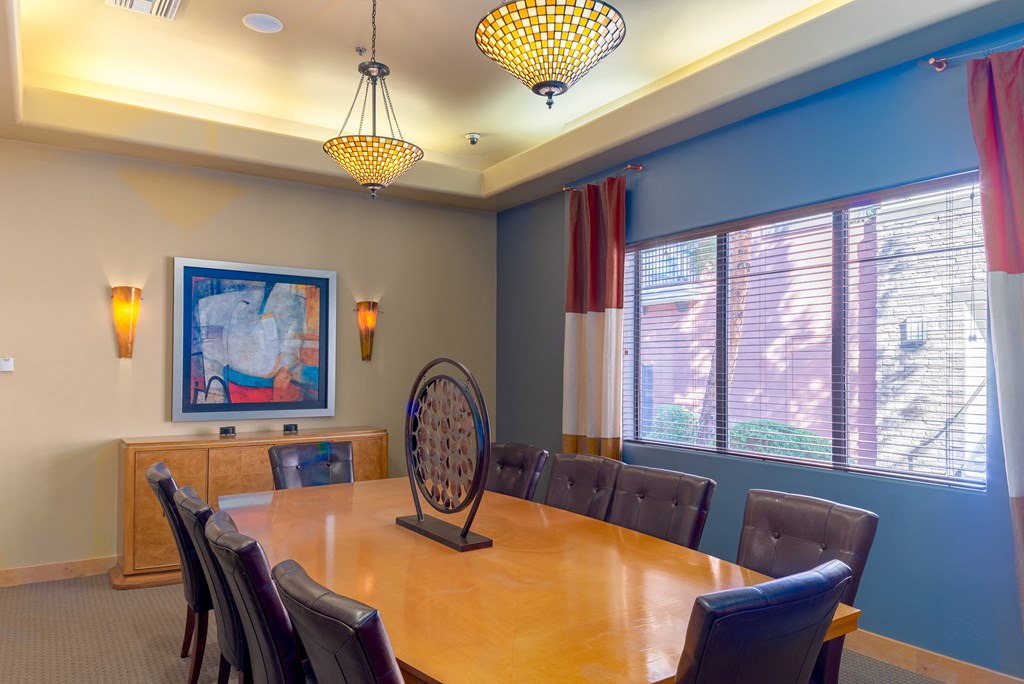 a conference room with a large table and chairs