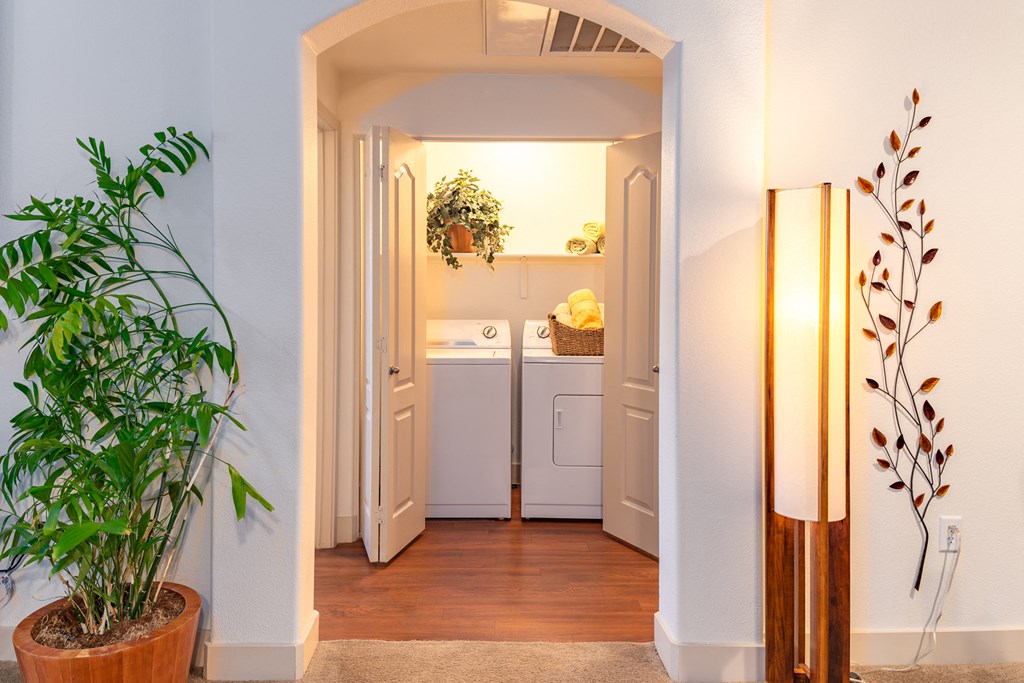 a small laundry room with a washer and dryer