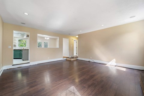 A room with wooden floors and a white ceiling.