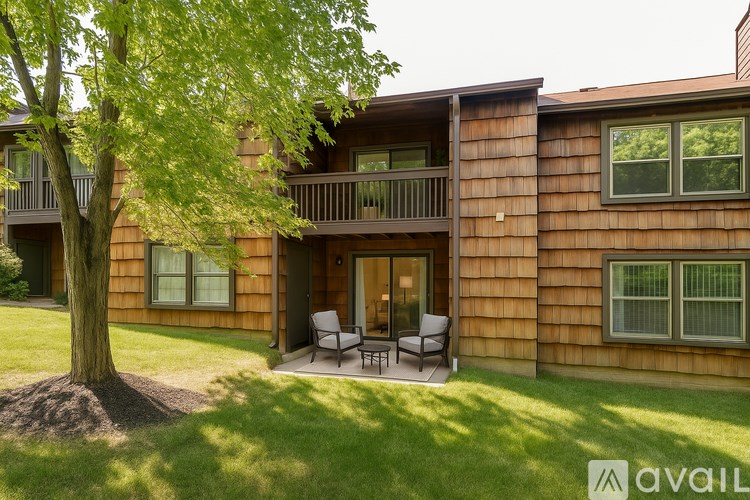 A room with white shelves and a wooden floor.