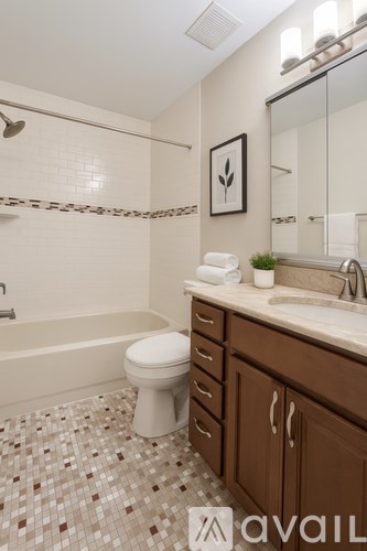 A small laundry room with a washer and dryer.