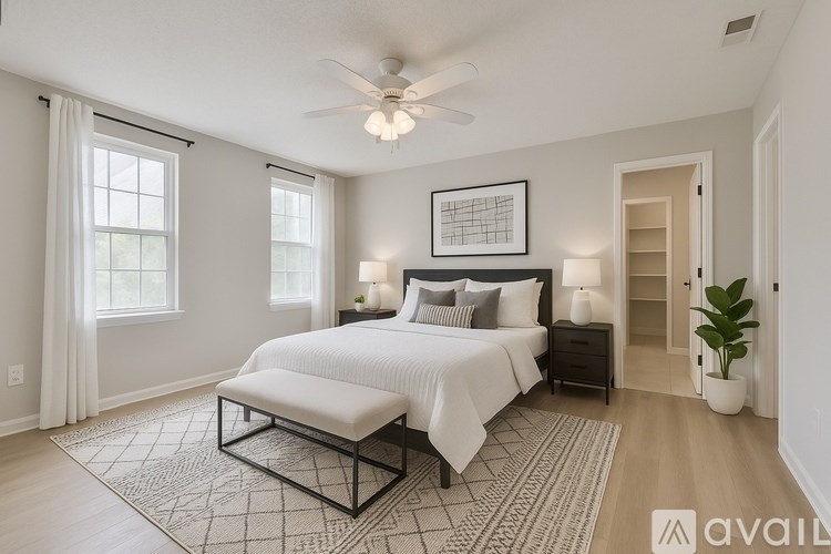 A bathroom with a sink, toilet, and shower.
