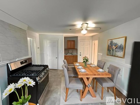 A kitchen with a table set for a meal.