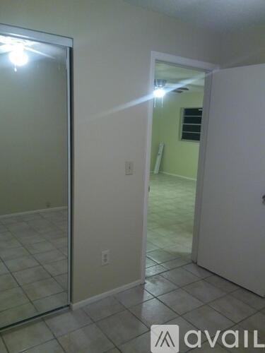 A room with a glass door and a white door.