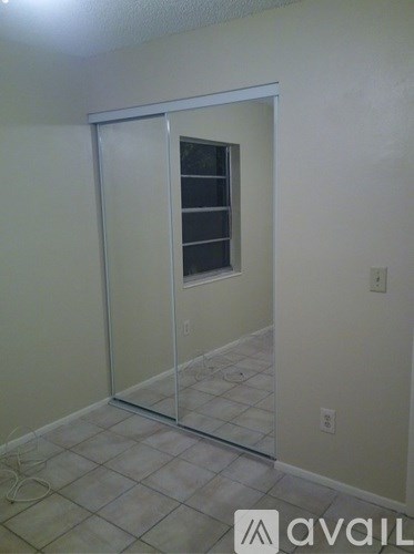 A room with a glass door and a window.