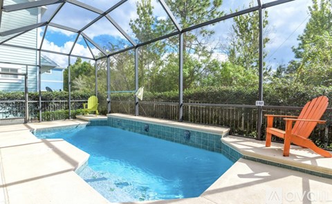 A small pool with a glass ceiling and a chair.