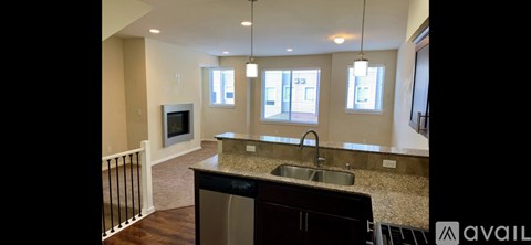 A kitchen with a sink and a counter top.
