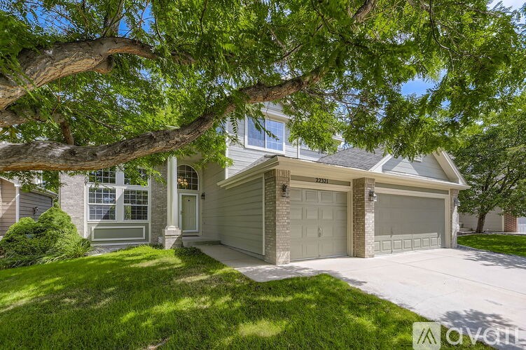 A house with a tree in front of it.