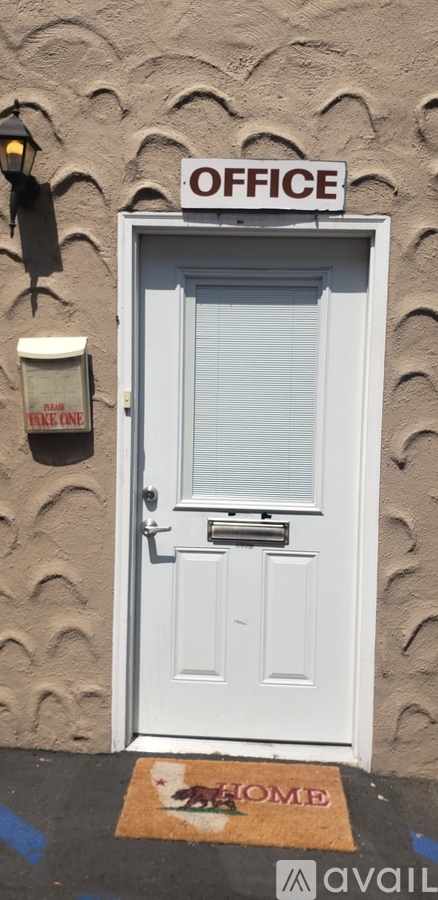 A white door with a sign that says "OFFICE" above it.