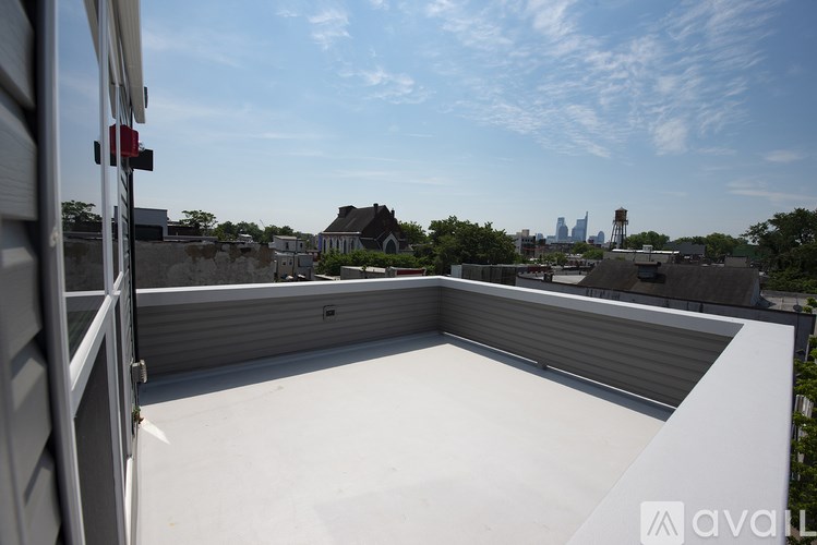 A rooftop with a view of the city skyline.
