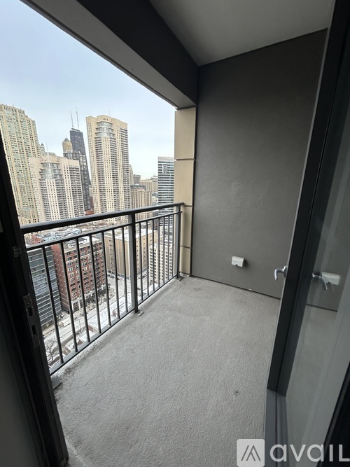 A balcony with a view of a city skyline.