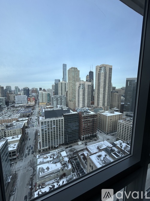 A cityscape with tall buildings and a clear sky.