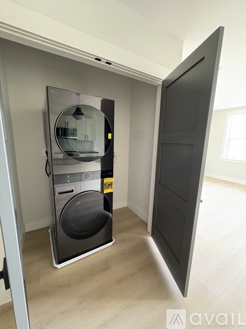 A modern laundry room with a washer and dryer.
