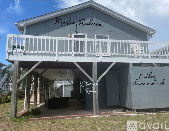 A house with a balcony and a sign that says "Master Bedroom" on it.