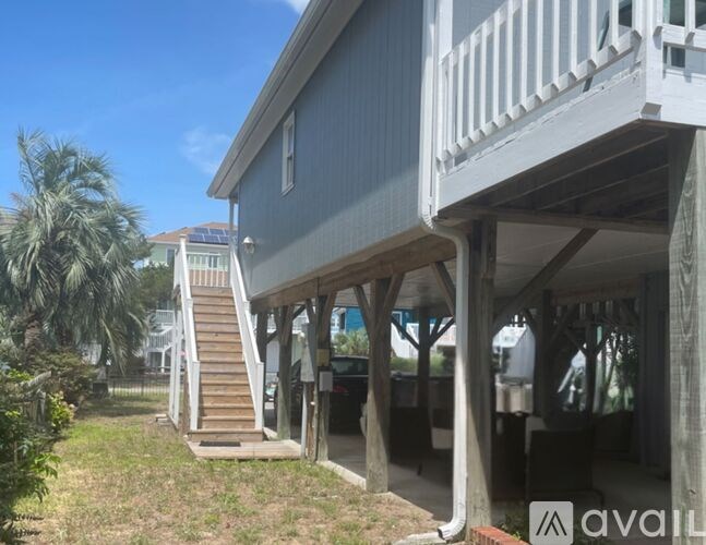 A house with a staircase leading to the second floor.