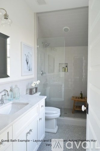 A chandelier hangs from a ceiling fan in a room.
