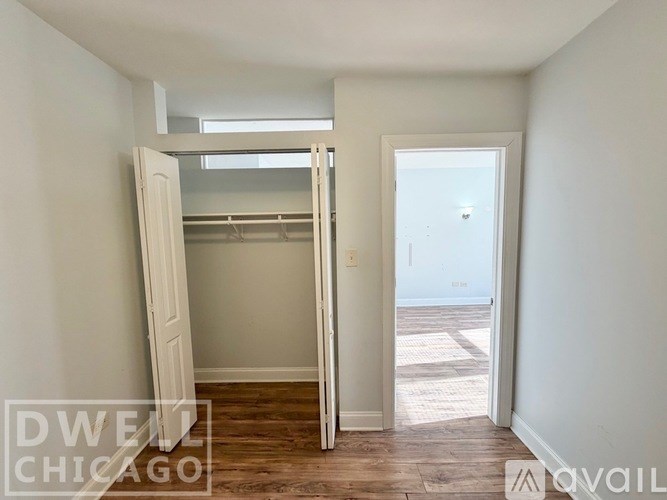 A white wooden medicine cabinet with a mirror above a drawer.