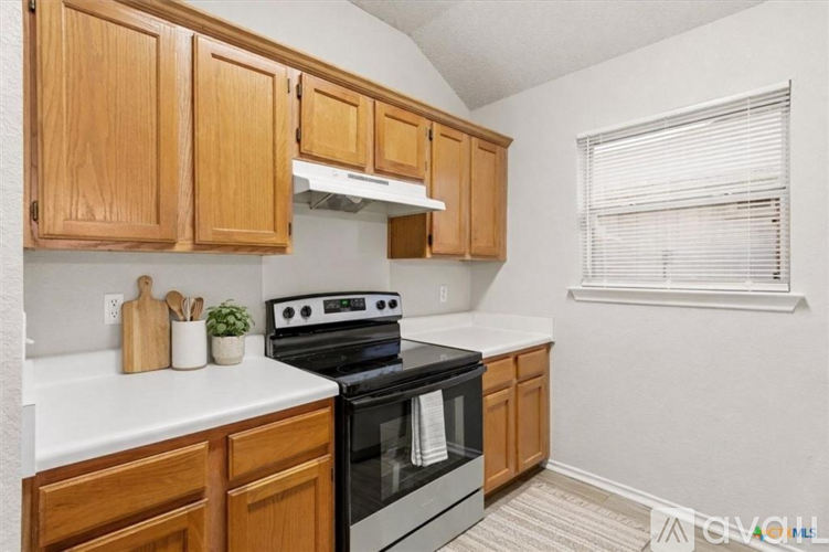A house with a stone exterior is for sale.