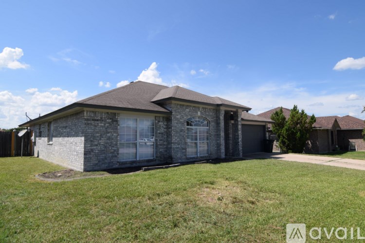 A house with a stone exterior is for sale.