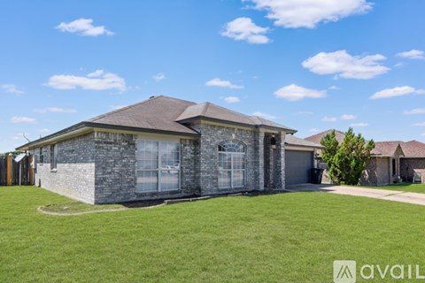 A house with a stone exterior is for sale.